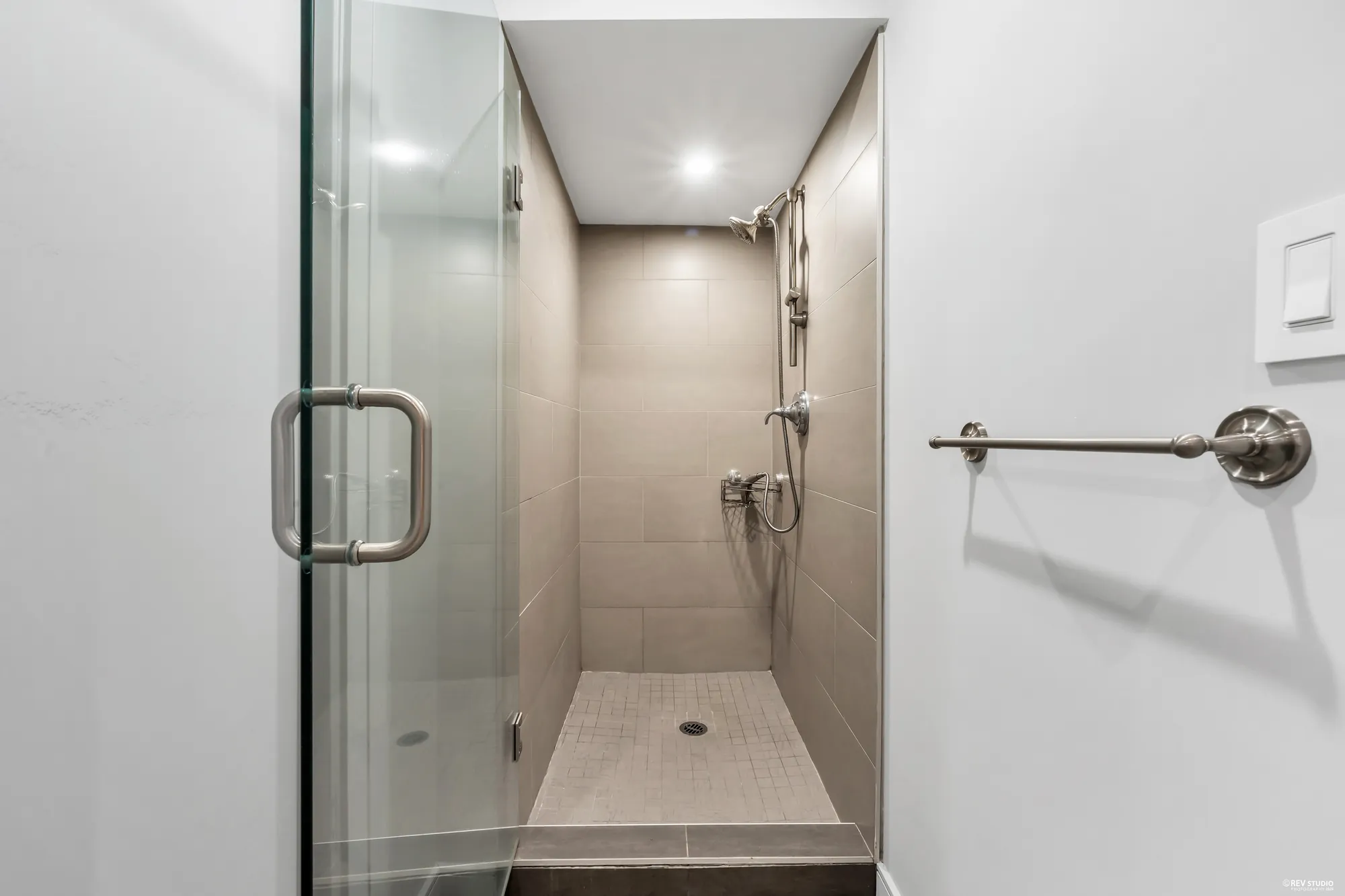 The glass shower compartment beside it