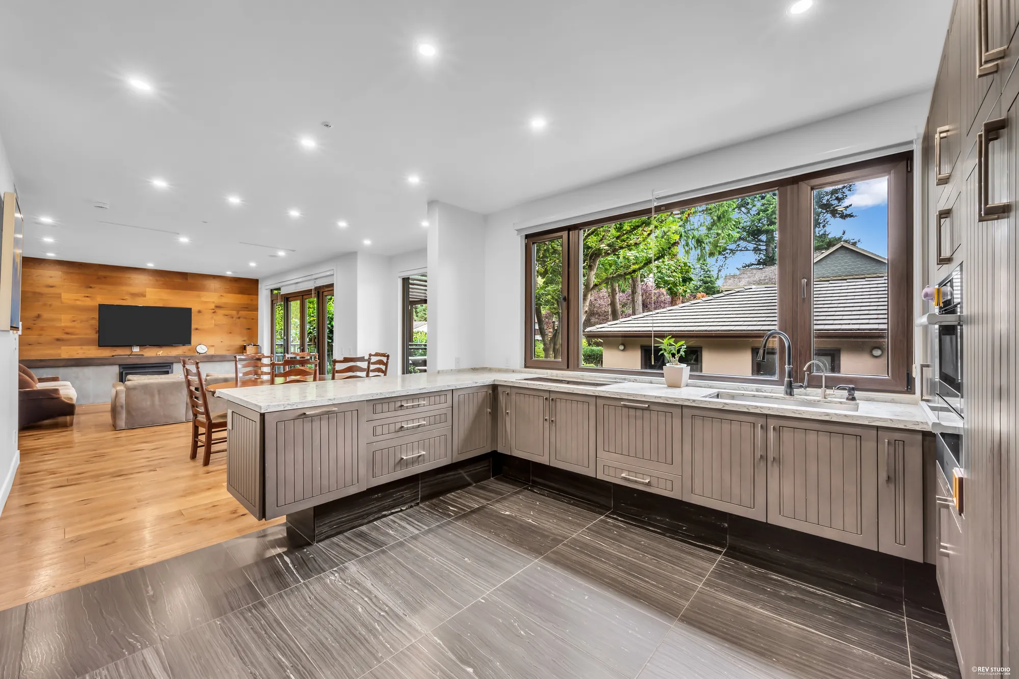 The kitchen from the nook, the family room beyond
