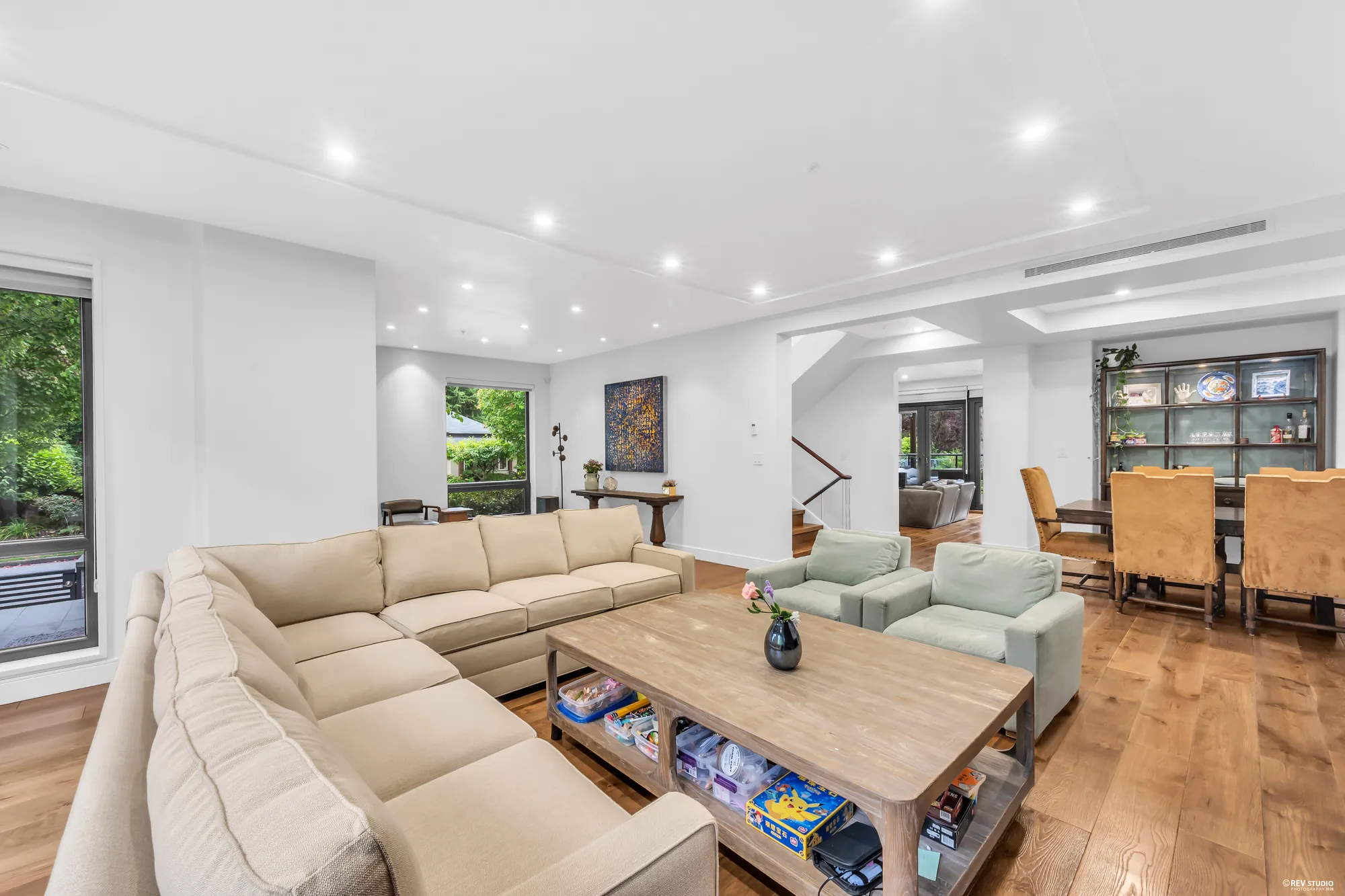 Across the sectional to the dining room